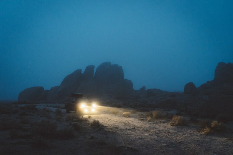 Truck driving in the dark with its headlights on