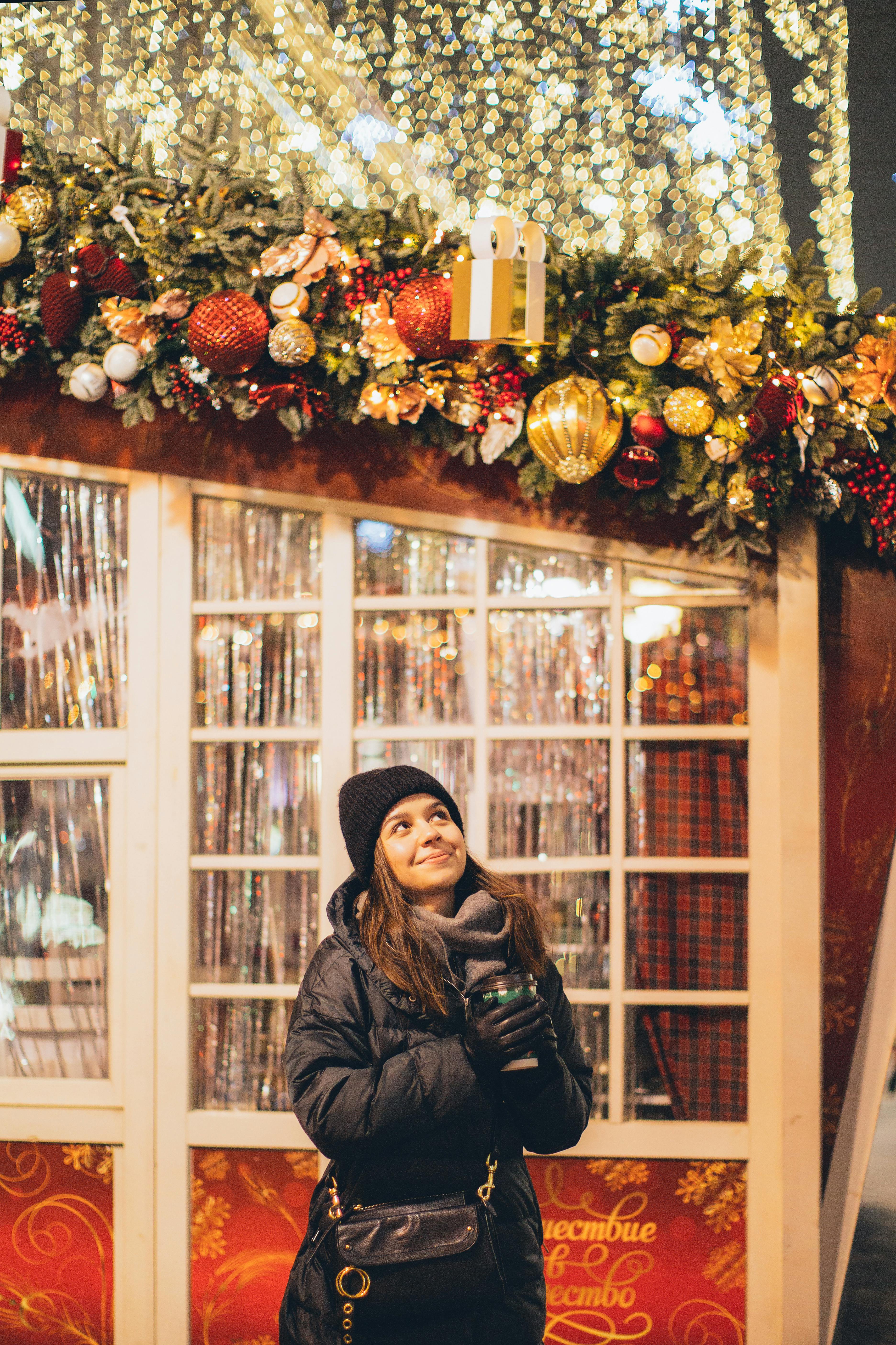 Women staring at Christmas decorations on a house